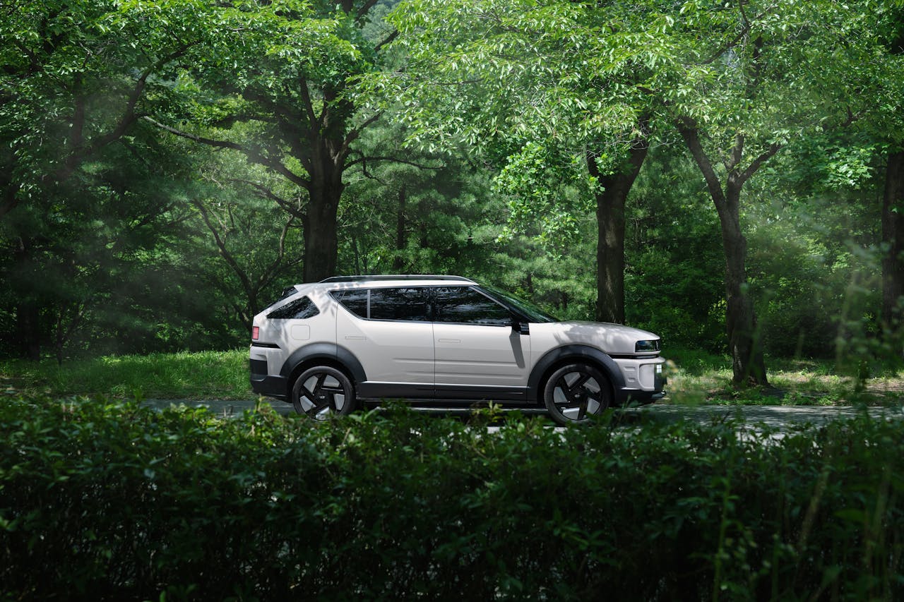 Home The Hyundai NEXO parked quietly in a dense forest.